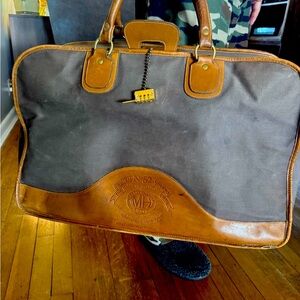 Brown and Tan Leather Travel Bag with Durable Design